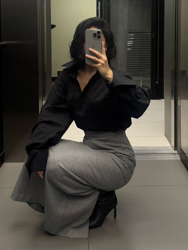 Classy woman taking mirror pictures 