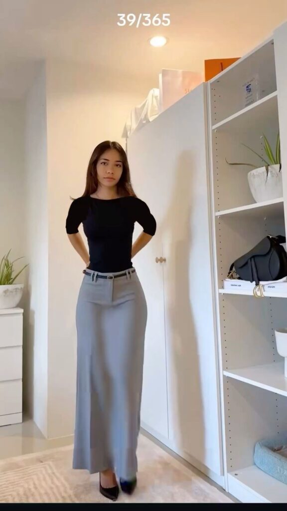 Lady putting on a unique outfit for work