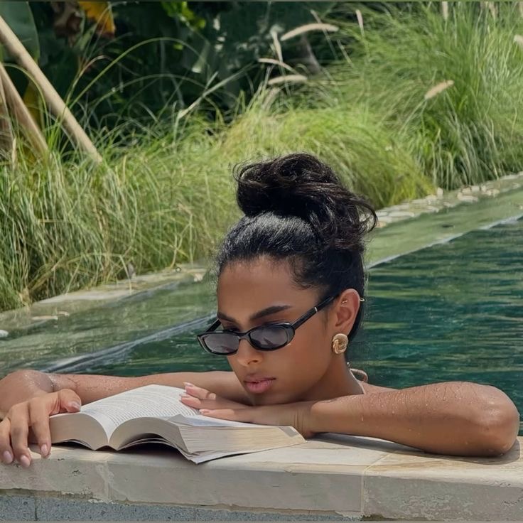 Lady reading in the pool