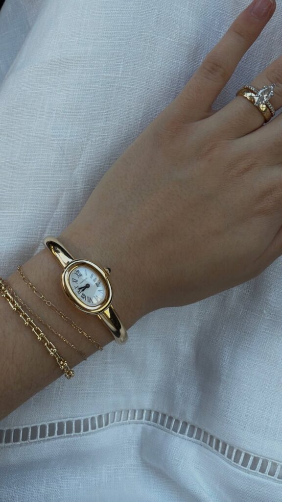 Lady putting on wristwatche