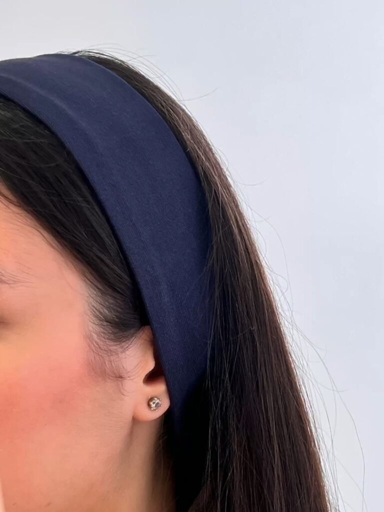 Classy lady putting on a headband