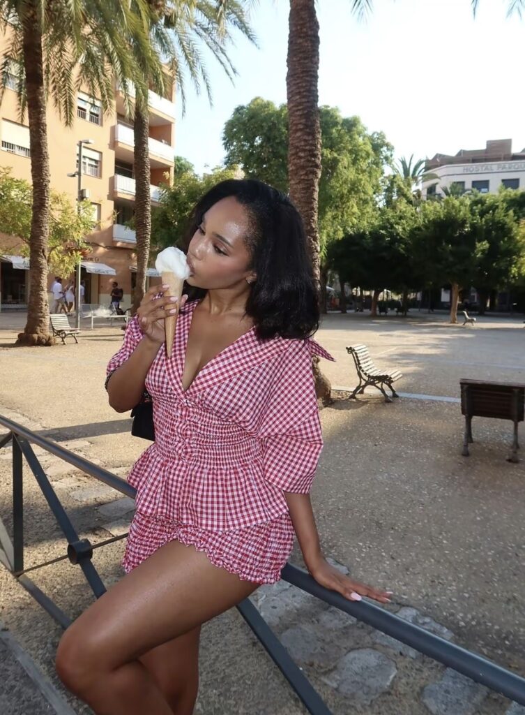 Lady putting on a a classy red checkered outfit for summer vacation