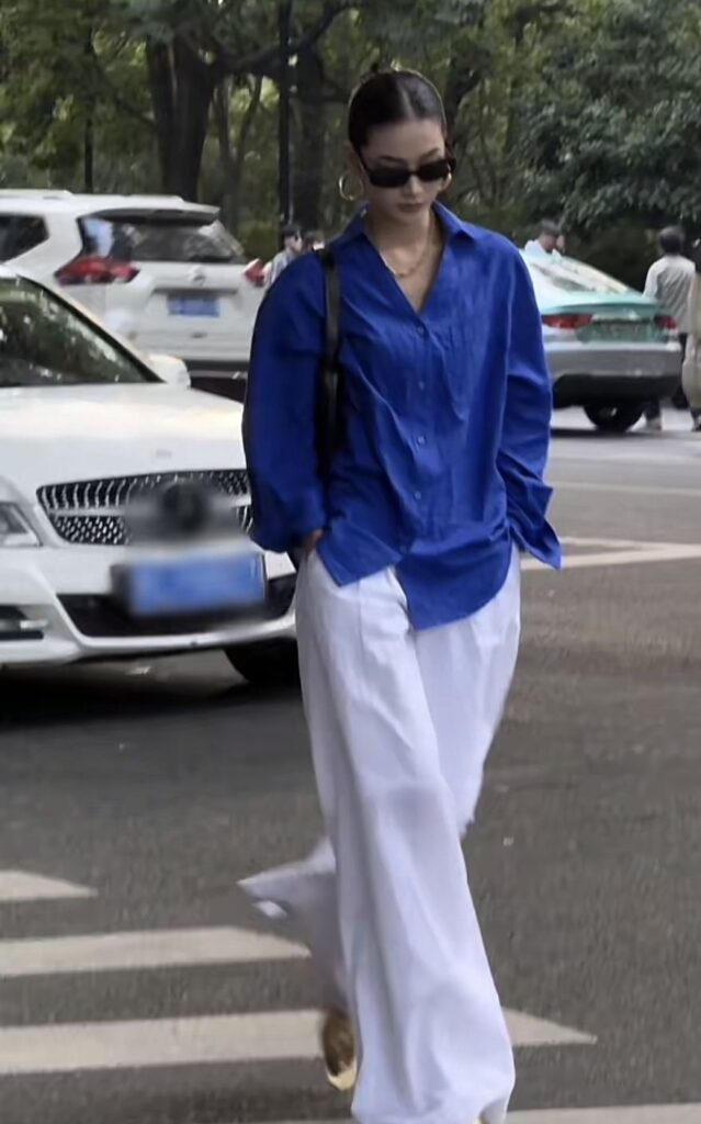 Lady putting on a casual but chic outfit 